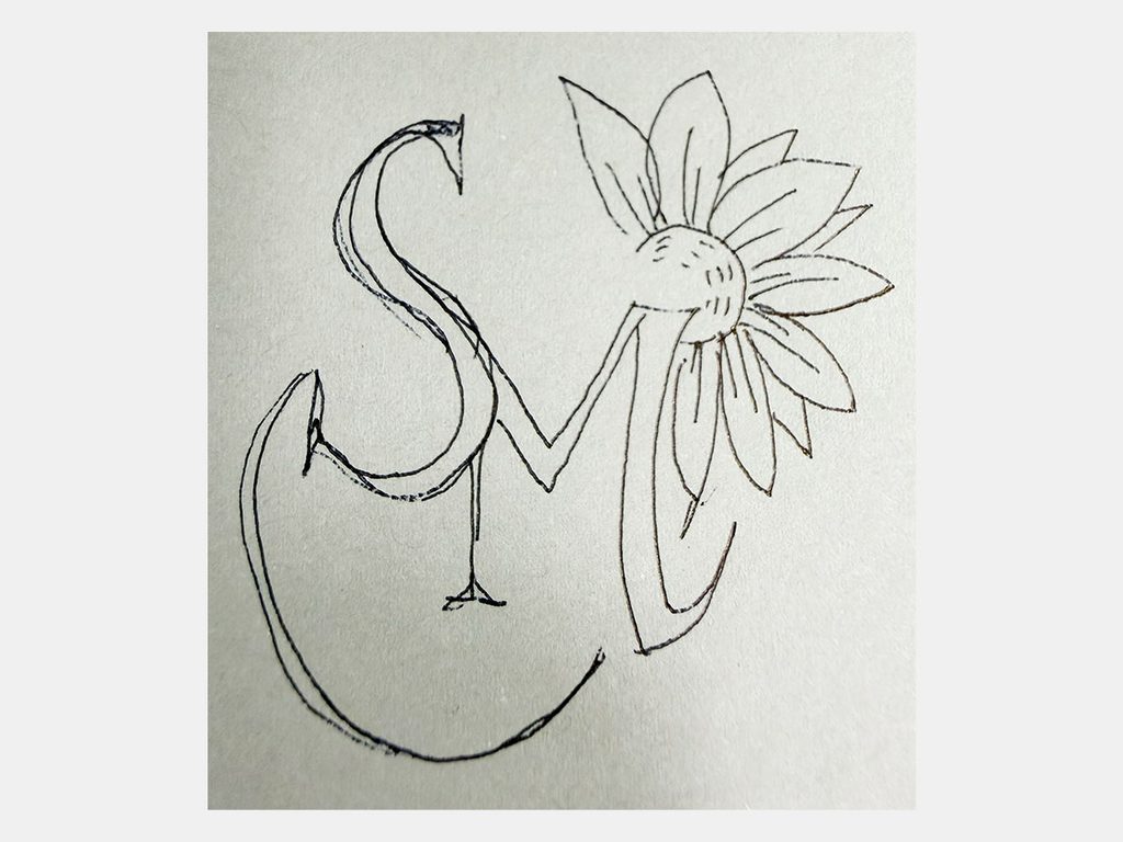 S・Mの文字と花のモチーフを検討したロゴの手描きラフ